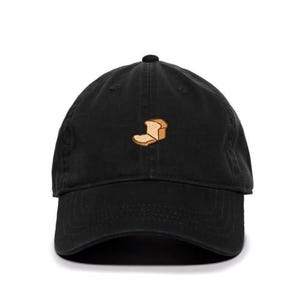 May include: A black baseball cap with a small embroidered image of a slice of bread.