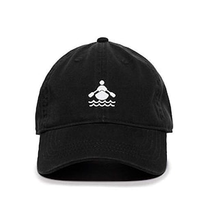 May include: A black cotton baseball cap with a white embroidered design of a person rowing a boat in water.