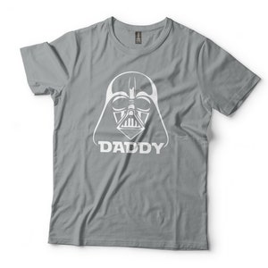 May include: Gray t-shirt with a white Darth Vader silhouette and the word "DADDY" underneath.