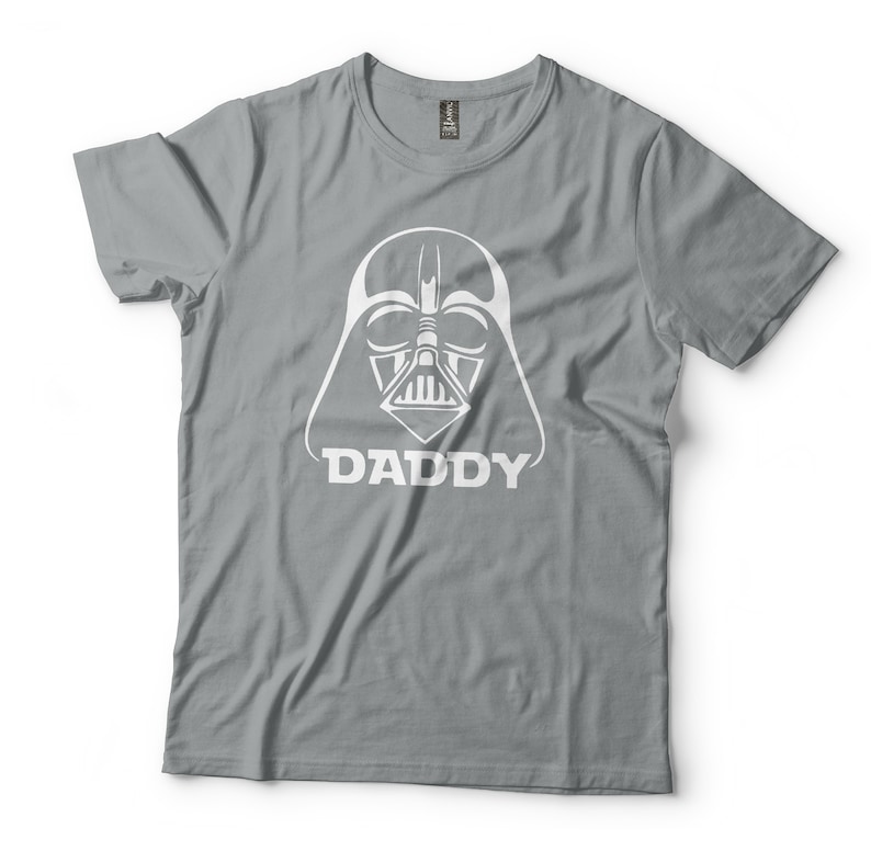 May include: Gray t-shirt with a white Darth Vader silhouette and the word "DADDY" underneath.