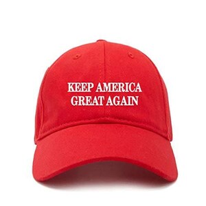 May include: A red baseball cap with the text "Keep America Great Again" embroidered in white.