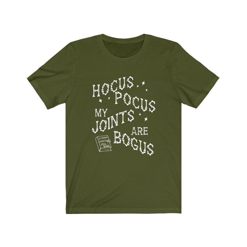 May include: A green t-shirt with a white graphic that says "Hocus Pocus My Joints Are Bogus" with a small book image that says "Chronic Haxing Spell Book".