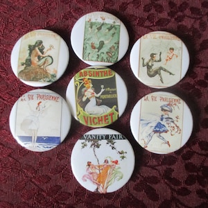 May include: Eight vintage style round buttons with various images. The buttons feature images of a mermaid, a woman in a dress, a woman with a drink, a woman in a bathing suit, a woman in a dress, a woman in a dress, a woman in a dress, and a woman in a dress. The buttons are all white with a black border.
