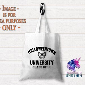May include: White tote bag with black text that reads "Halloweentown University Class of '98". The text is in a circular design with a small pumpkin graphic inside.