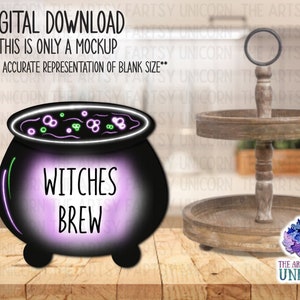 May include: A digital download featuring a black cauldron with the words "Witches Brew" in white. The cauldron has a purple glow and green and purple bubbles. A two-tiered wooden tray is to the right. The text "DIGITAL DOWNLOAD" is at the top.