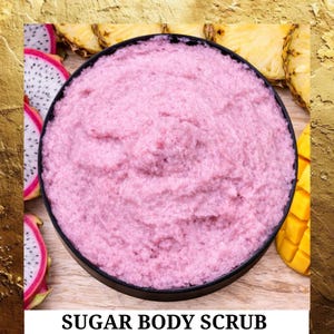 May include: A pink sugar body scrub in a black bowl, surrounded by slices of dragon fruit, pineapple, and mango. The text "SUGAR BODY SCRUB" is at the bottom of the image.