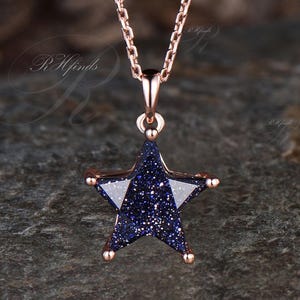 May include: A set of three ceramic mugs with a speckled, matte finish. The mugs are in shades of cream, light gray, and dark gray. Each mug has a simple, minimalist design, perfect for coffee or tea.