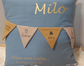 Pillow with birth dates and pennant