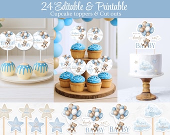 May include: Baby shower decorations featuring cupcake toppers, cutouts, and a cake topper. Designs include teddy bears, balloons, and the word "Baby". The colour scheme is blue, white, and gold. Cupcakes and cake pops are also visible in the image.