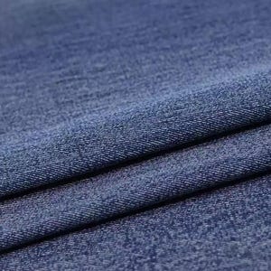 Puede incluir: Primer plano de una tela vaquera azul con un tejido texturizado.