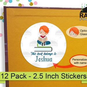 May include: A pack of 12, 2.5 inch round personalized bookplate stickers. Each sticker features a cartoon illustration of a child sitting on a stack of books and reading. The text "This book belongs to" is printed above the name "Joshua".