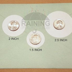 May include: Three white circles with a silver US quarter inside each circle. The circles are labeled with the diameter of each circle: 2 inch, 1.5 inch, and 2.5 inch.