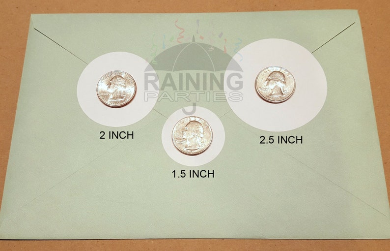 May include: Three white circles with a silver US quarter inside each circle. The circles are labeled with the diameter of each circle: 2 inch, 1.5 inch, and 2.5 inch.