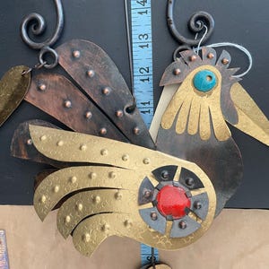 Cesar Vasquez J hanging copper bird