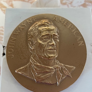 Vintage John Wayne brass