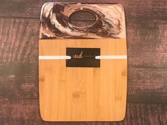 Hand poured resin bamboo cheese/cutting board in blush,ivory, and wine 12x9 with gold trim