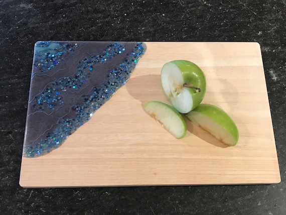 Hand poured in moon and ice blue with glitter accent resin cheese/cutting board 12x7.5 white pine