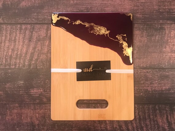 Hand poured resin bamboo cheese/cutting board in purple and gold 11x8 with gold trim