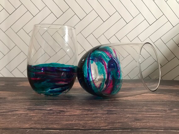 Set of two hand painted teal, fuchsia, and purple resin covered stemless wine glasses 20.5oz