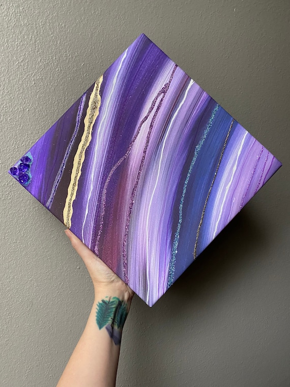 12 x 12 gallery wrapped canvas print of original resin art in shades of purple and blue with gold details, crystals, and hand line accents