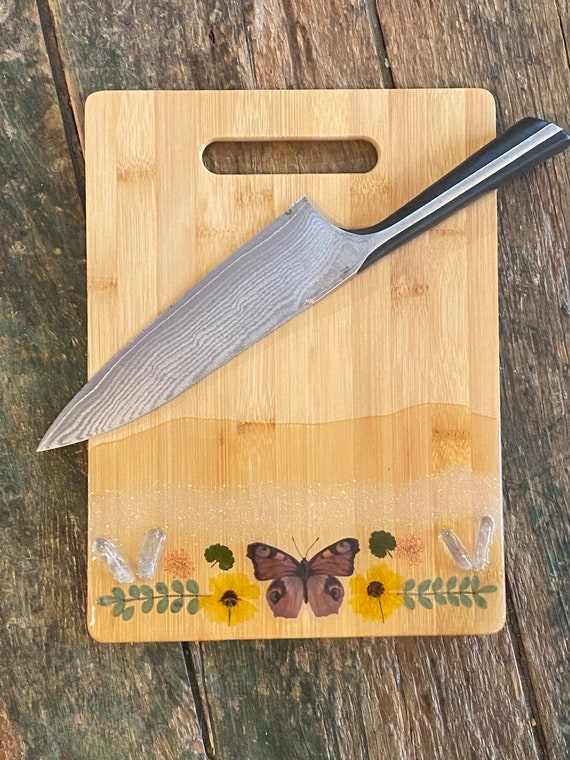 12x8 bamboo butterfly cutting board with quartz crystal points and pressed flowers coated in resin perfect for cheese charcuterie or party