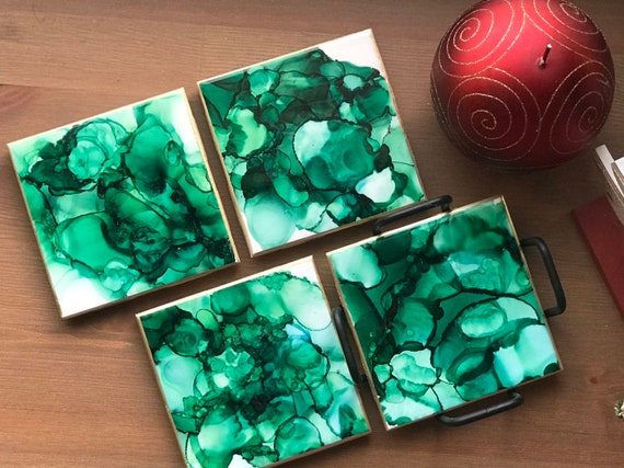 Hand painted 4pc coaster set with metal holder in Hunter green,gold, and white ceramic tile with cork backer sealed with resin