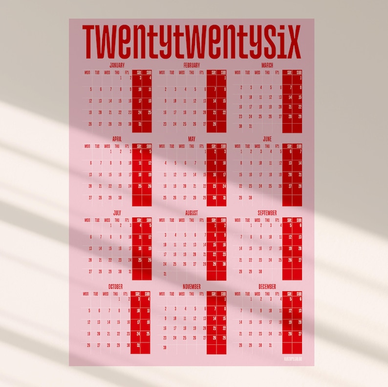 May include: A pink 2026 calendar with red text. The word "Twentytwentysix" is at the top. Each month is displayed in a grid format with the days of the week and dates. The calendar is a simple and modern design.