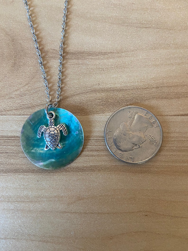 Coin shell and turtle charm necklace