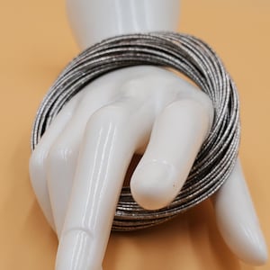 Vintage 48 interlocked silver tone metal bangle bracelets