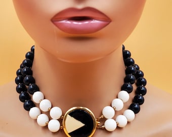 vintage Les Bernard double strand blue and white beaded choker with enamel medallion clasp