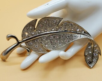 vintage XXL silver tone clear rhinestone folded feather brooch