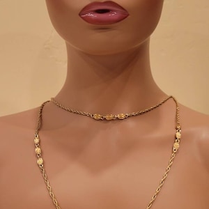 Vintage Monet extra long gold tone chain necklace with textured bead accents