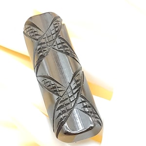 Vintage black carved Bakelite bar brooch