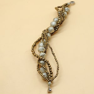 Teng Tue gold tone 5 strand twist snap bracelet