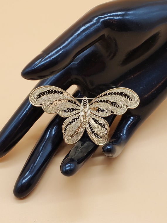 Vintage gold tone filigree butterfly brooch