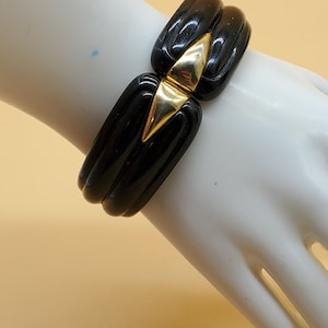 vintage chunky black plastic bangle with gold tone middle