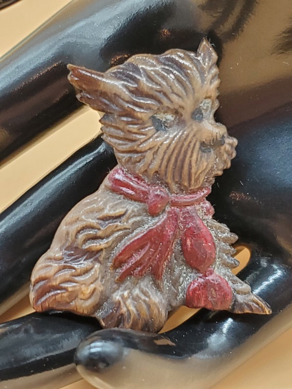 Vintage celluloid scottie dog brooch with red bow