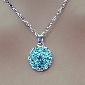 Vintage NRT Avon silver tone chain necklace with blue crystal covered pendant
