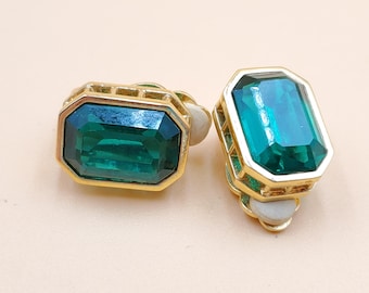 vintage Swarovski swan gold tone green stone clip-on earrings