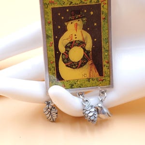 Vintage Marjolein Bastin holiday snowman brooch with dangling charms