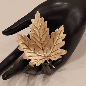 Vintage Crown Trifari gold tone textured maple leaf brooch