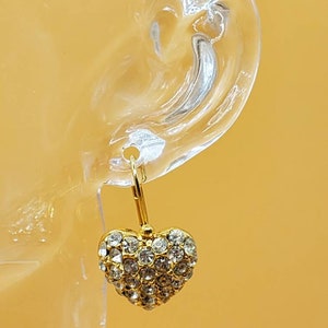 Vintage gold tone dangling heart earrings with clear rhinestones made in the USA