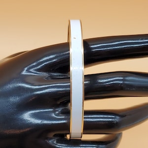 Vintage Monet gold tone white enamel bangle bracelet