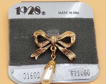 Vintage 1928 bow pin with dangling faux pearl