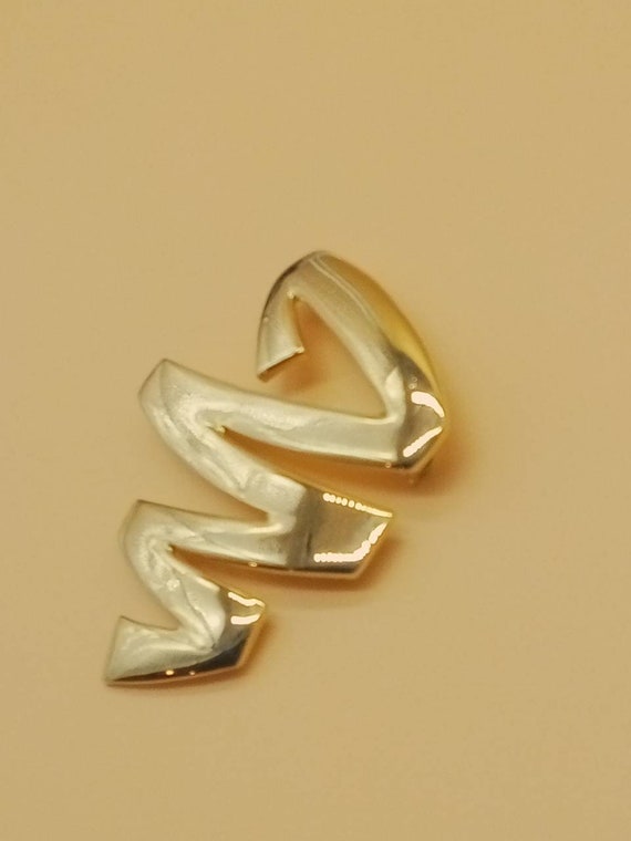 Vintage M Jent gold tone tornado brooch