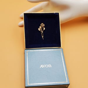 vintage Avon gold over sterling rose brooch with diamond chip center