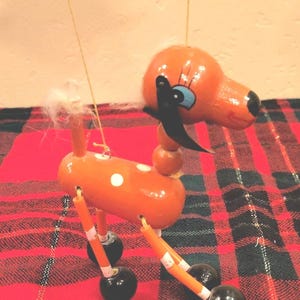 Vintage wooden 2 string loose leg dog marionette