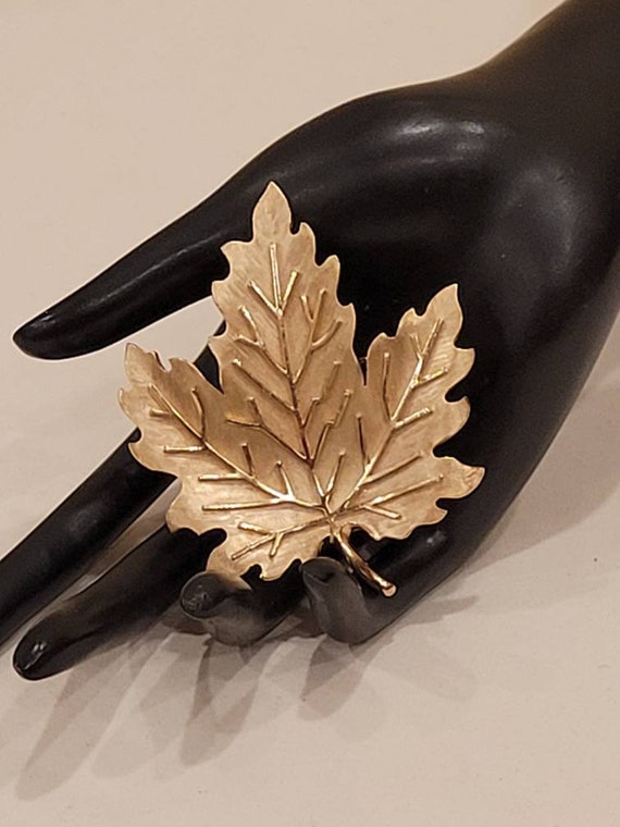 Vintage Crown Trifari gold tone textured maple leaf brooch