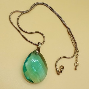 Vintage bronze tone snake chain necklace with green glass prism pendant