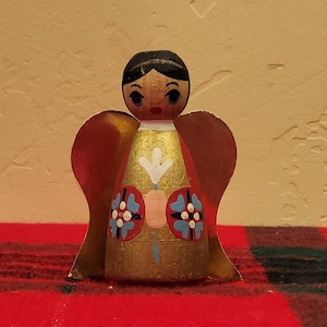 Vintage handmade wooden Christmas angel with cardboard foil wings